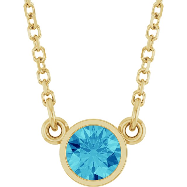 december blue zircon round solitaire necklace in 14k yellow gold