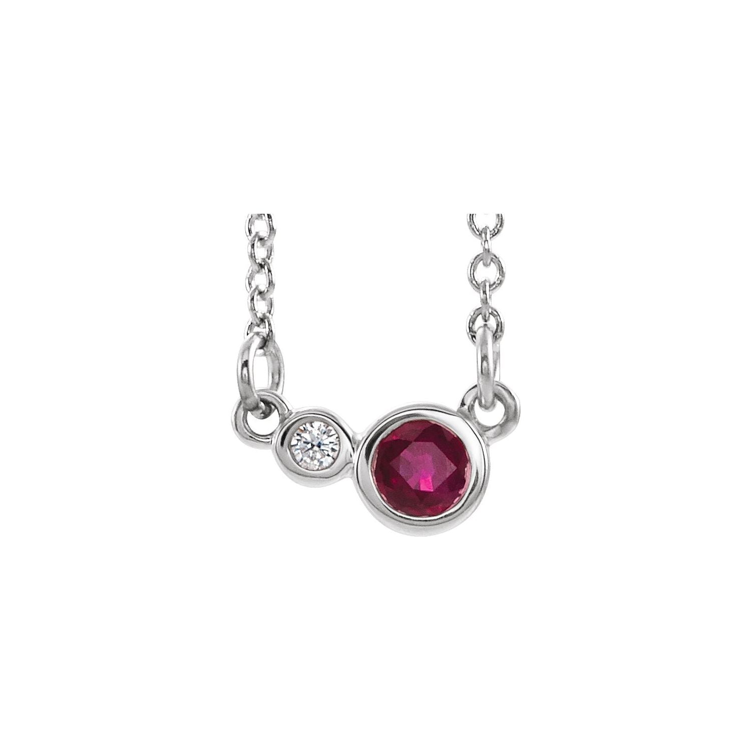14K White Gold bezel-set station ruby necklace with a 4 mm round natural ruby bezel beside a natural diamond bezel