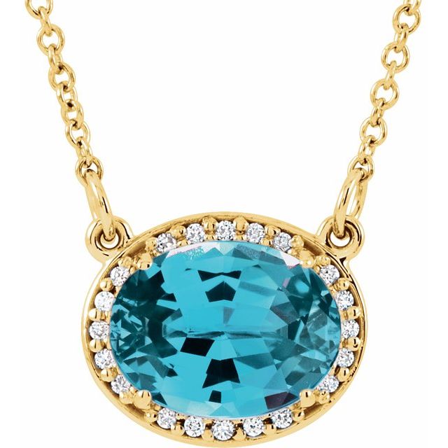swiss blue topaz diamond halo necklace in 14k yellow gold