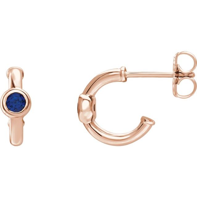 blue sapphire huggie hoop earrings in 14k rose gold