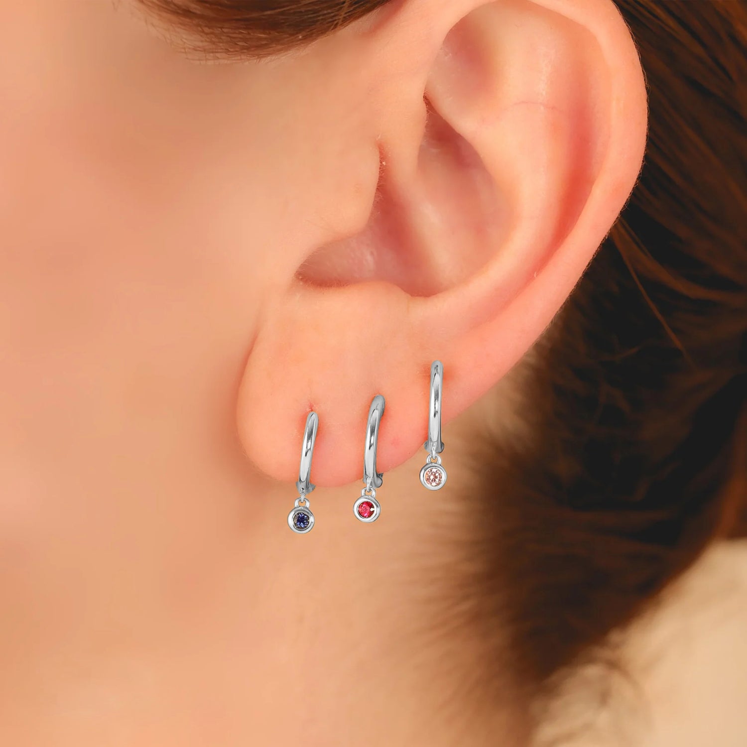 Round Ruby Bezel Huggie Earrings in 14K White Gold (0.08ct) Front View 2
