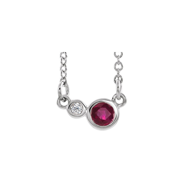 14K White Gold bezel-set station ruby necklace with a 4 mm round natural ruby bezel beside a natural diamond bezel