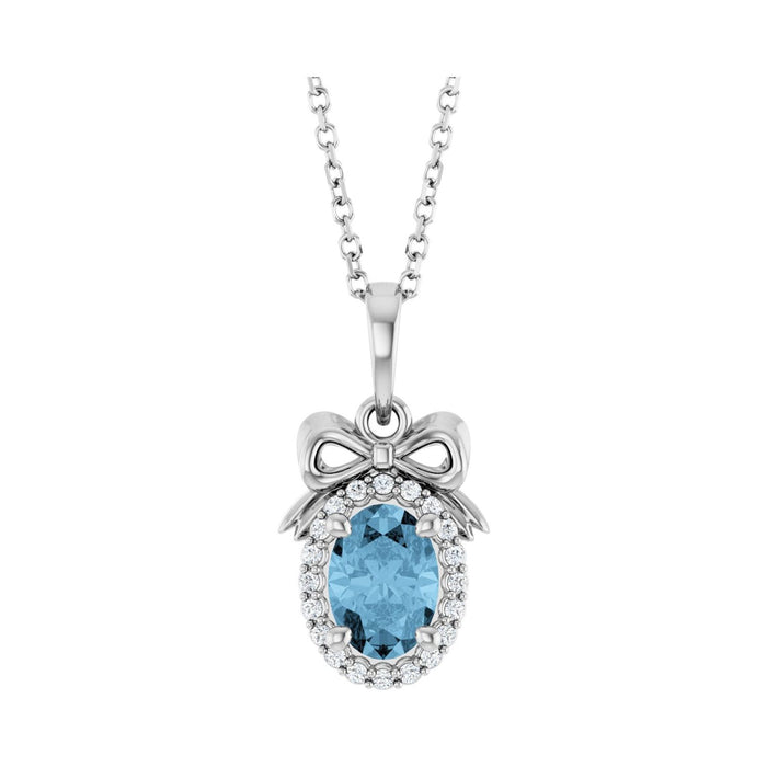 14K White Gold oval london blue topaz necklace with a diamond halo and sculpted bow