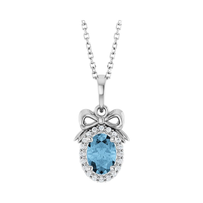 Blue Topaz Pendant with a Diamond Bow in 14K White Gold