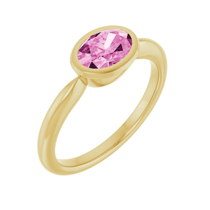 oval pink sapphire ring in 14k Yellow Gold